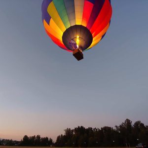 Hot air balloon fabric glowing from the light of the burners
